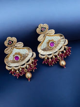 Exquisite Golden Kundan Earrings with Ruby Accents